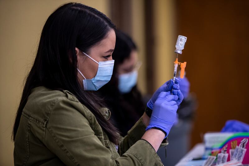 Nurses prepare doses of Covid-19 vaccine at a pop-up vaccination clinic in Los Angeles, California. EPA