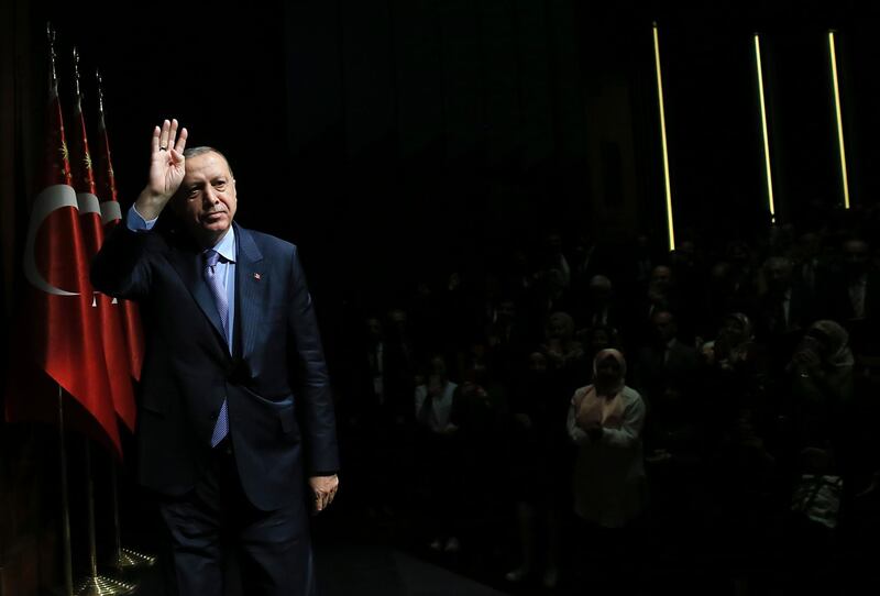 Turkey's President Recep Tayyip Erdogan waves to supporters during an event in Ankara, Turkey on Tuesday, May 8, 2018. Thousands of people took to Twitter to say "that's enough" to Erdogan who is running for re-election on June 24 presidential elections. (Presidency Press Service via AP, Pool)