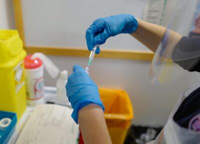 TRURO, ENGLAND - DECEMBER 09: A staff nurse at the Royal Cornwall Hospital prepares to administer  Covid-19 vaccinations as the hospital began their vaccination programme on December 9, 2020 in Truro, United Kingdom. More than 50 hospitals across England were designated as covid-19 vaccine hubs, the first stage of what will be a lengthy vaccination campaign. NHS staff, over-80s, and care home residents will be among the first to receive the Pfizer/BioNTech vaccine, which recently received emergency approval from the country's health authorities. (Photo by Hugh Hastings/Getty Images)