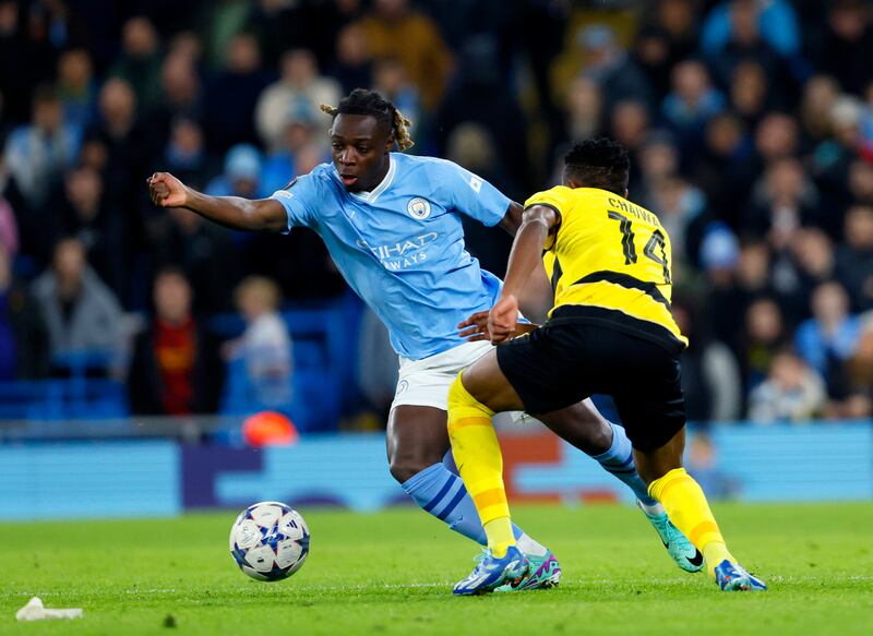Manchester City winger Jeremy Doku and Young Boys' Miguel Chaiwa battle for the ball. PA
