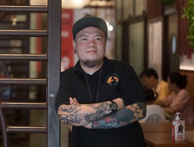 Ralph Joseph Cruz, a restaurant supervisor at Off The Hook, has reduced personal spending and now saves more for his family’s future beyond their everyday needs. Ruel Pableo for The National