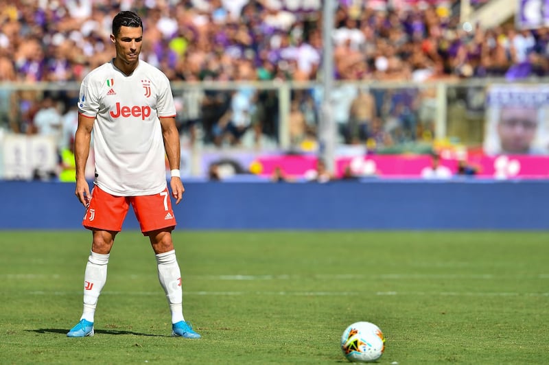 Juventus' Portuguese forward Cristiano Ronaldo prepares to shoot a free kick during the Italian Serie A match against Fiorentina at the Artemio-Franchi Stadium in Florence. The match ended 0-0. AFP