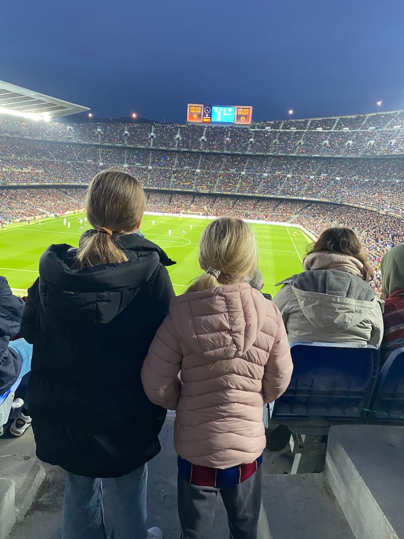 Andy Mitten's daughters watch the game among the record crowd at Camp Nou. Andy Mitten