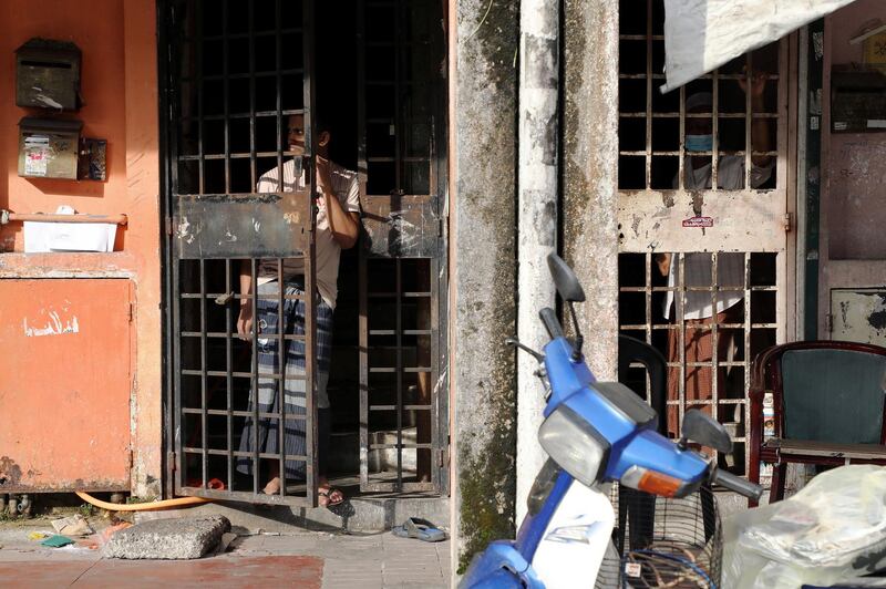 Rohingya refugees look out from their homes, amid the coronavirus disease (COVID-19) outbreak, in Kuala Lumpur, Malaysia May 18, 2020. Picture taken May 18, 2020. REUTERS/Lim Huey Teng