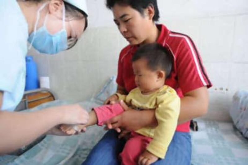 A young Chinese child undergoes treatment at a hospital after taking tainted milk powder, in Hefei, eastern China's Anhui province.