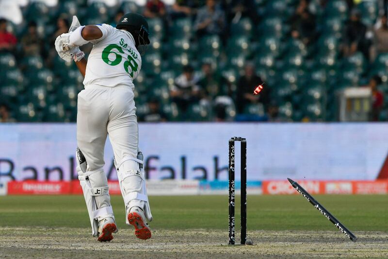 Pakistan's Sajid Khan is clean bowled by Australia captain Pat Cummins. AFP