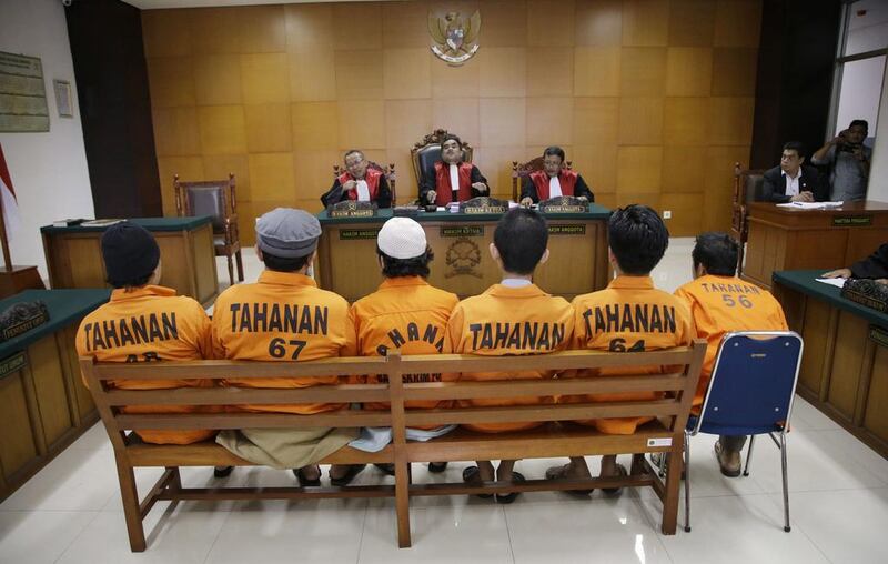 Suspected militants attend a sentencing hearing in Jakarta, Indonesia on June 7. The country’s military chief said there are ISIL cells across all of Indonesia. Achmad Ibrahim / AP Photo