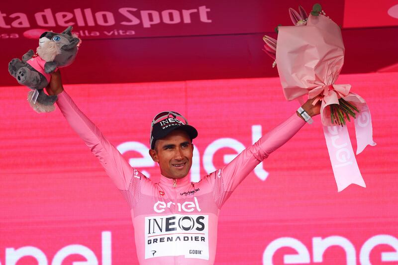 Team Ineos' Ecuadorian Jhonatan Narvaez celebrates on the podium his overall leader's pink jersey, after he won the stage 1 of the Giro d'Italia 2024 cycling race, 140 km between Venaria Reale and Turin on May 4, 2024.  The 107th edition of the Giro d'Italia, with a total of 3400,8 km, departs from Veneria Reale near Turin on May 4, 2024 and will finish in Rome on May 26, 2024.  (Photo by Luca Bettini  /  AFP)