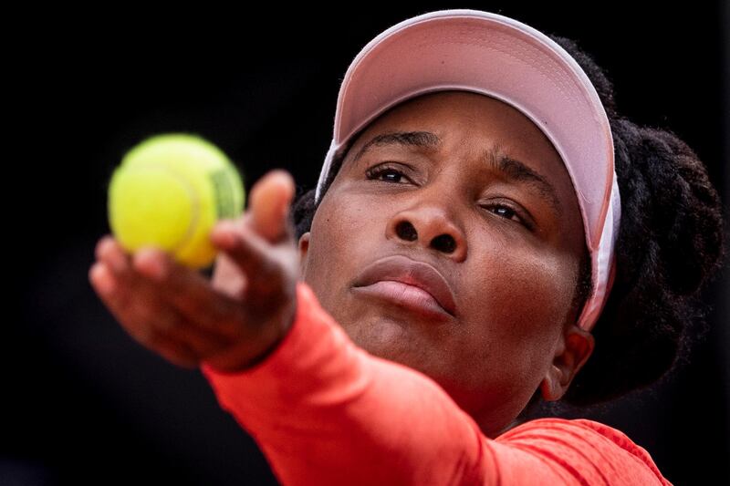 American Venus Williams serves to Jennifer Brady during their match at the Madrid Open on Friday, April 30. Brady won the game 6-2, 6-4. AP