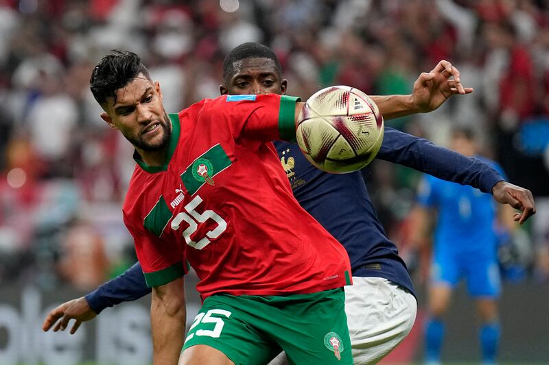 France's Ousmane Dembele and Morocco's Yahia Attiyat Allah challenge for the ball. AP