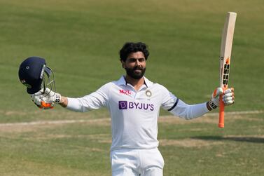 India's Ravindra Jadeja celebrates after scoring a century during the second day of the first test match between India and Sri Lanka in Mohali, India, Saturday, March 5, 2022.  (AP Photo / Altaf Qadri)