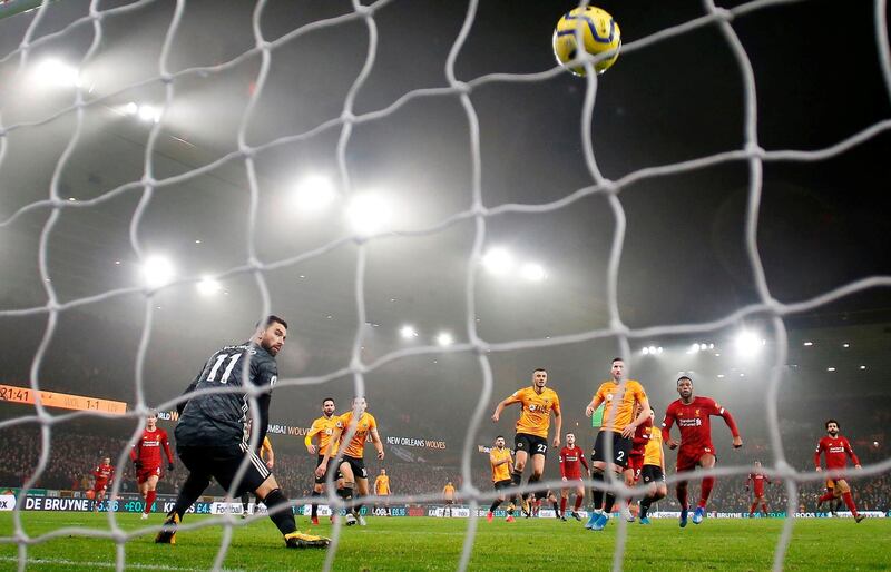 Liverpool's Roberto Firmino scores their second goal at the Molineux Stadium. Reuters