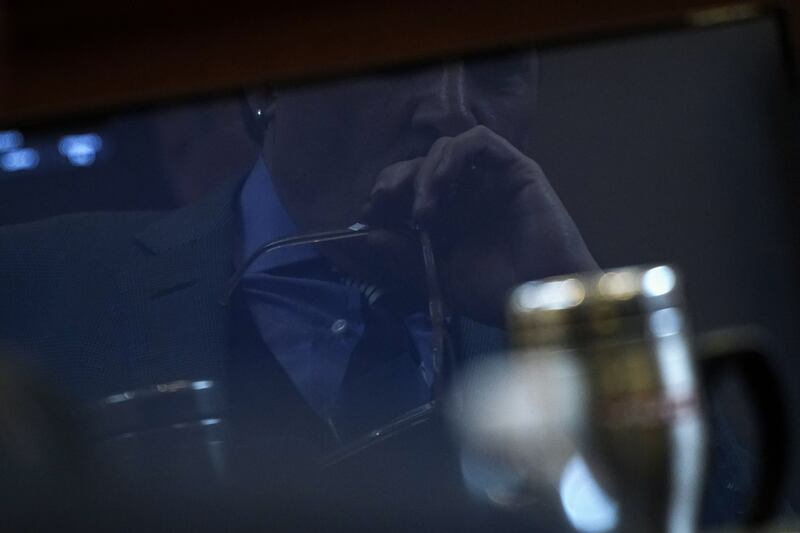 Depp is reflected in a courtroom monitor while listening to an audio recording. AFP