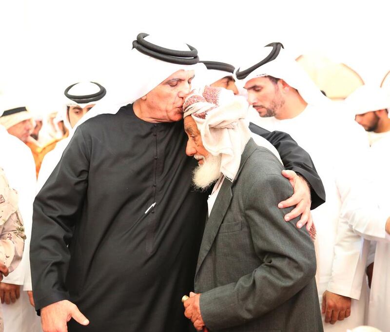 Sheikh Saud bin Saqr Al Qasimi, Ruler of Ras Al Khaimah, consoles a family member at the funeral of WO Rashid Ali Mohammed Al Duhouri in Ras Al Khaimah in February 2017. Wam