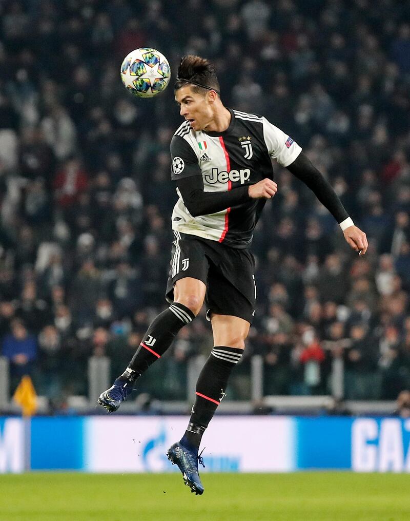 Ronaldo jumps for the ball during the Champions League match between Juventus and Atletico Madrid at the Allianz stadium in Turin. AP