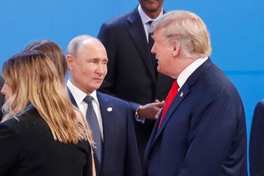 President Donald Trump walks past Russia's President Vladimir Putin at the start of the G20 summit in Argentina. AP