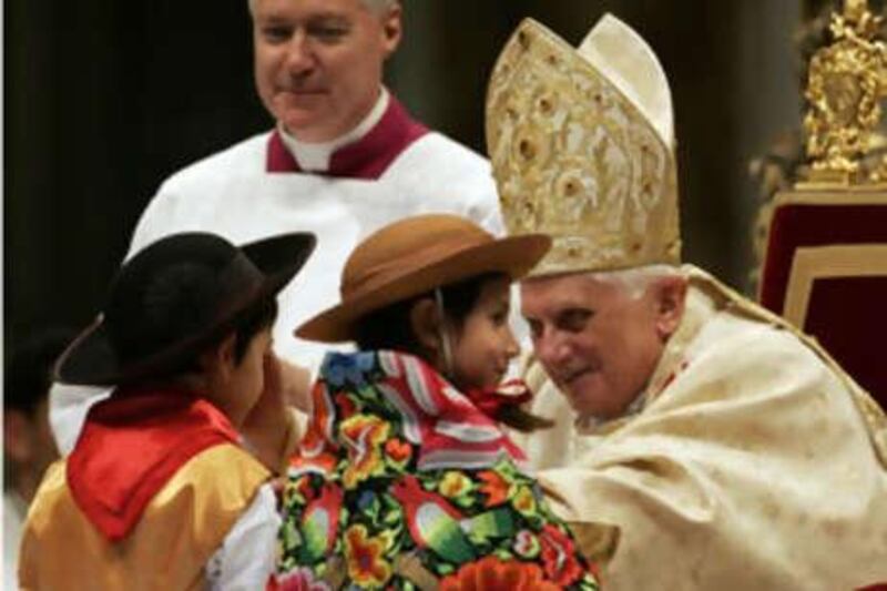 Pope Benedict XVI blesses children as he celebrates the Christmas Midnight Mass in St Peter's Basilica at the Vatican, early on Dec 25 2008.