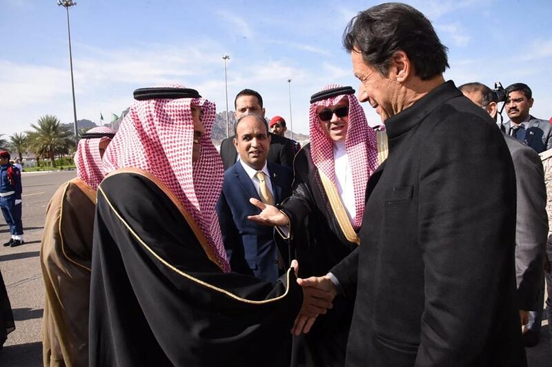Prime Minister of Pakistan Imran Khan, right, being met by Deputy Governor of Madinah Waheb Al Hosli. Twitter/ @PakPMO