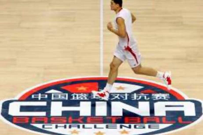 China's basketball team player Yao Ming runs during a training session at a stadium in Guangzhou, in China's southern Guangdong province Sunday, Aug. 6, 2006. China will play against USA August 7, which is the first time a USA Basketball team featuring NBA players has played in China.  (AP Photo/Kin Cheung)