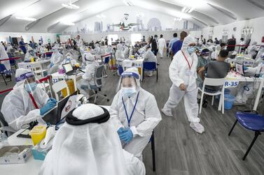 A laser screening centre for Covid-19 on the Abu Dhabi border screens more than 6,000 people every day. Antonie Robertson / The National