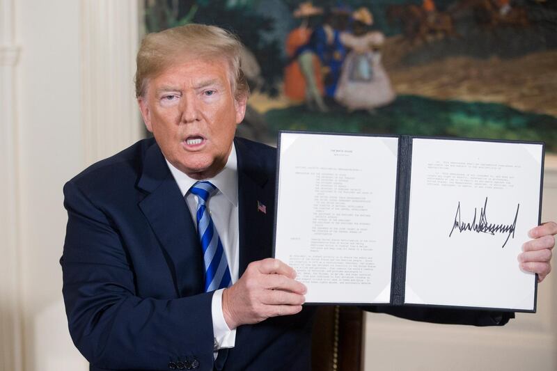 epaselect epa06720241 US President Donald J. Trump holds up a national security presidential memorandum on Iran that he just signed in the Diplomatic Reception Room of the White House in Washington, DC, USA, 08 May 2018.  Trump announced plans to pull out of Iran nuclear deal. Trump announced that he will reimpose sanctions that had been waived under the Iran nuclear deal. Five nations including the United States worked out a deal with Iran in 2015 that withdrew sanctions.  EPA/MICHAEL REYNOLDS