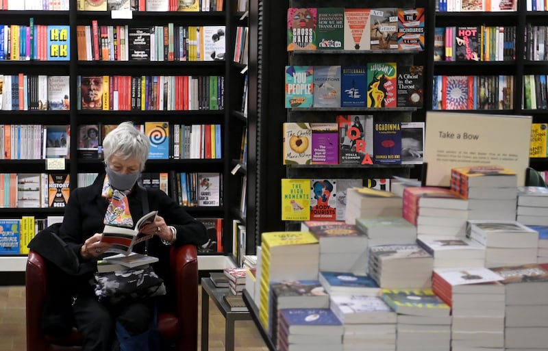 A woman browsing in a bookshop in London. EPA