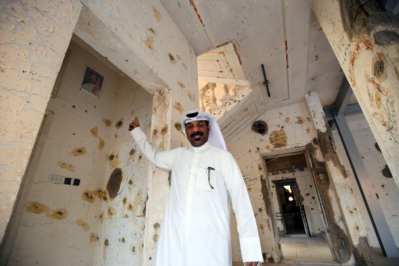 Hazem Jaber, a Kuwaiti who fought the Iraqi troops during the invasion of his country, is seen at the Al-Qurain Martyr's Museum on August 2, 2017, on the 27th anniversary of the 1990 Iraqi invasion of Kuwait.
The Al-Qurain Martyr's Museum is the home of a battle which lasted 10 hours between invading Iraqi troops and a group of Kuwaiti fighters during the Iraqi occupation of Kuwait. The battleground house has been converted to the Al-Qurain Martyr's Museum. / AFP PHOTO / Yasser Al-Zayyat