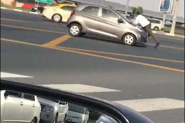  A video showing the man sitting on a moving car was widely shared on social media. Courtesy social media