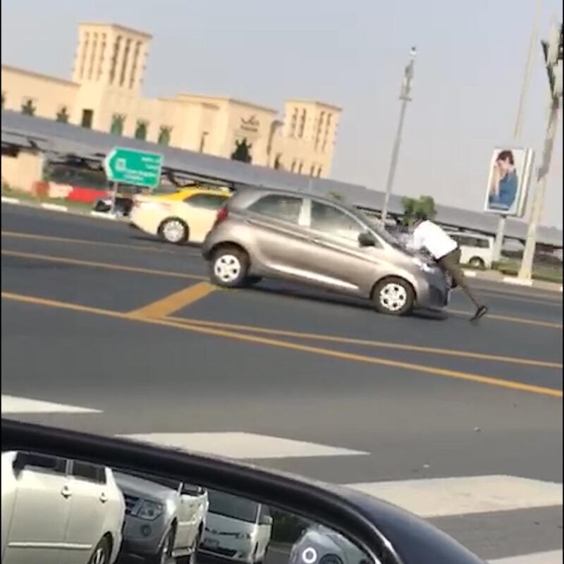  A video showing the man sitting on a moving car was widely shared on social media. Courtesy social media