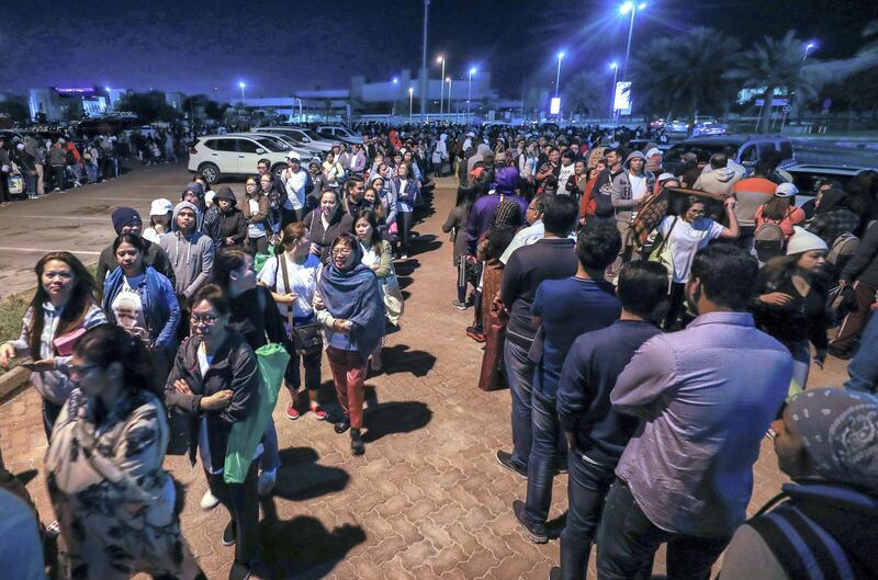 Abu Dhabi, U.A.E., February 5, 2019.   Worshipers heading onto buses at Nation Towers before they're transported to the mass.
Victor Besa/The National
Section:  NA
Reporter: