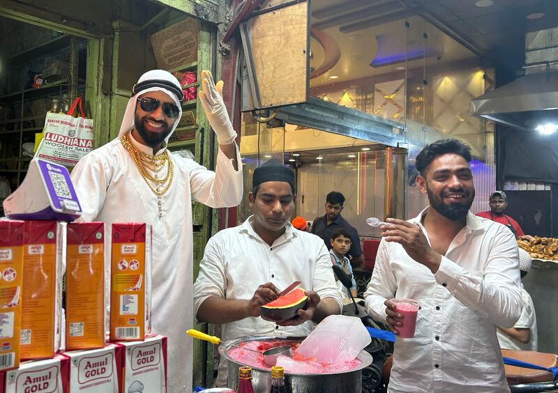A shopkeeper dressed as an Arab sells ‘Mohabbat-e-sharbat’ or the sherbet of love at Old Delhi. The bright pink drink is made with Rooh Afza, an ultra-sweet concoction of herbs and fruit, milk or water and garnished with diced watermelon. All photos: Taniya Dutta/The National