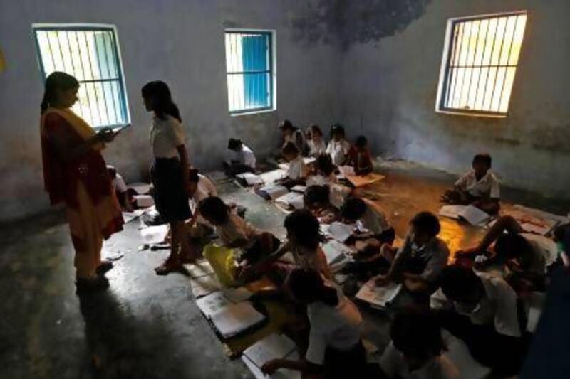 Schoolchildren study inside their classroom at their government-run primary school, at Brahimpur village in the Chapra district of the eastern Indian state of Bihar.
