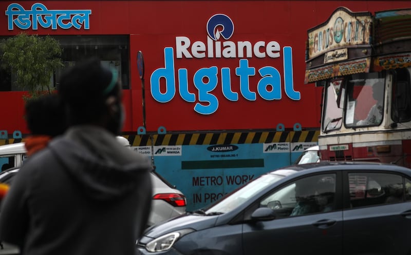 epa08547605 A general view of Reliance Digital billboard in Mira Road, near Mumbai, India, 15 July 2020. Reports on 15 July 2020 state Reliance Industries chairman and managing director Mukesh Ambani said Google would buy a 4.5 billion USD, 7.7 per cent stake in Jio Platforms, the digital to mobile part of Reliance.  EPA/DIVYAKANT SOLANKI