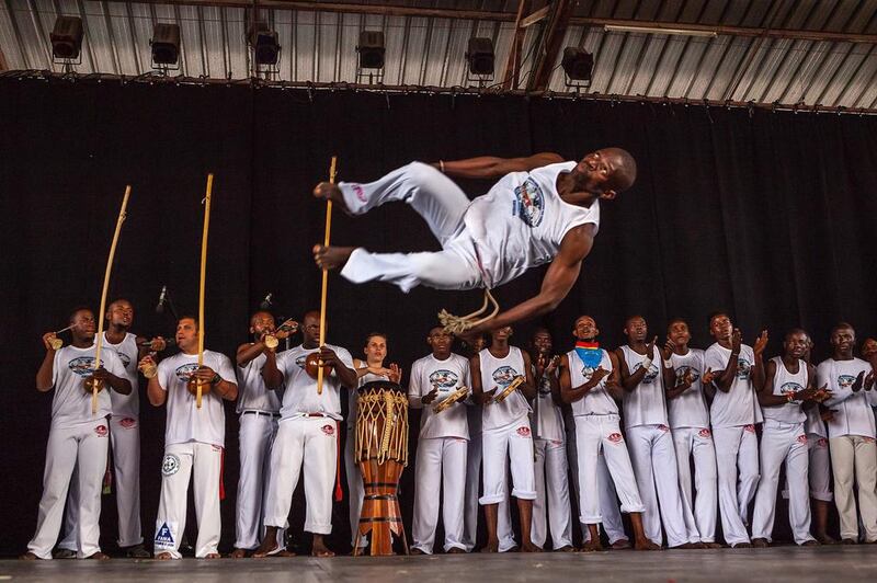 Men perform during a presentation of the Capoeira for Peace project in Kinshasa, Democratic Republic of the Congo. AFP