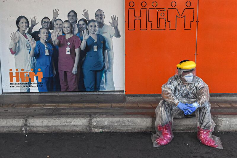 A health worker takes a break outside  Medellin's General Hospital in Medellin, Colombia. AFP