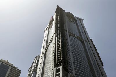 DUBAI, UNITED ARAB EMIRATES - AUG 4: 

Debris surrounding Dubai Marina's Torch Tower, one of the world's tallest residential buildings, after a fire started last night.


(Photo by Reem Mohammed/The National)

Section: NA