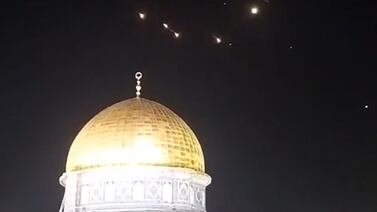 A video still from early on April 14 shows projectile trails above Al Aqsa Mosque compound in occupied East Jerusalem's Old City. AFP