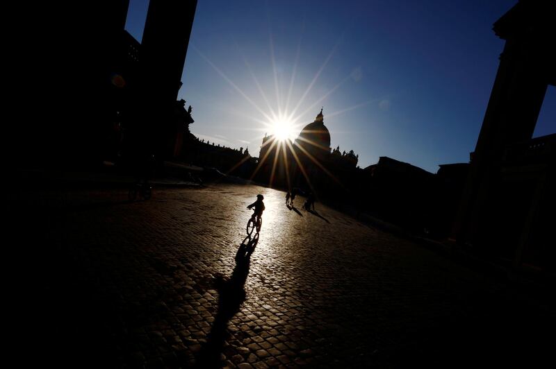 A boy rides his bike near St Peter's Square in Vatican City, Italy. Reuters
