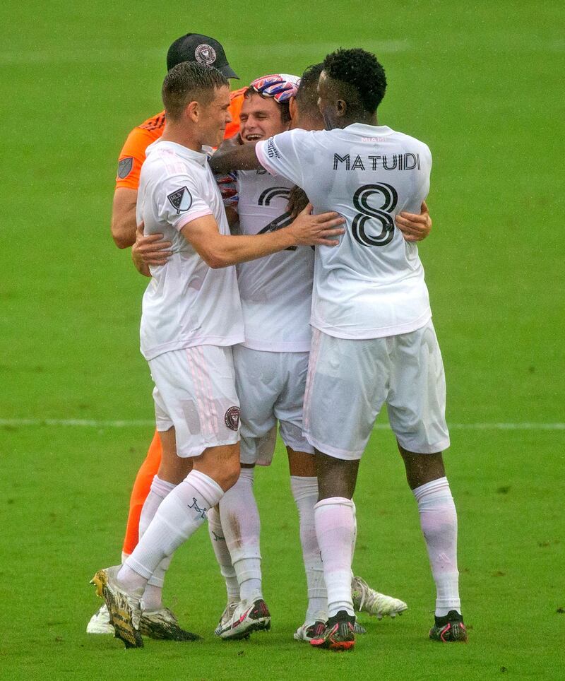 Inter Miami defender Mikey Ambrose is congratulated by teammates after scoring against Cincinnati. AP
