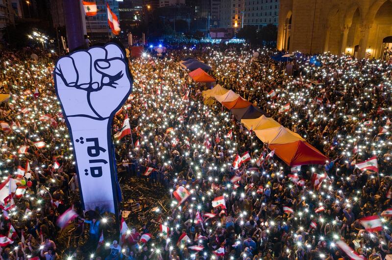 Lebanese protesters light up their phones as they gather at Martyrs' Square during ongoing anti-government protests in Beirut on November 3, 2019. Wael Hamzeh / EPA