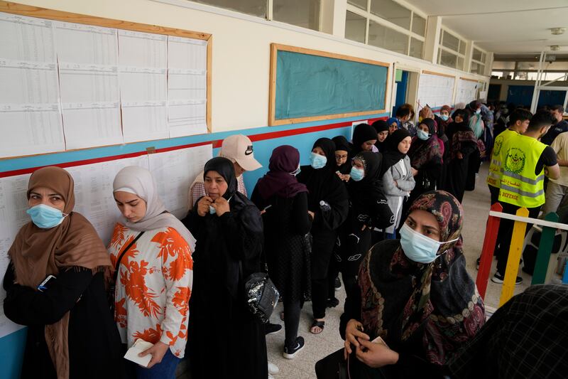 People queue to cast their votes in the Lebanese capital. AP
