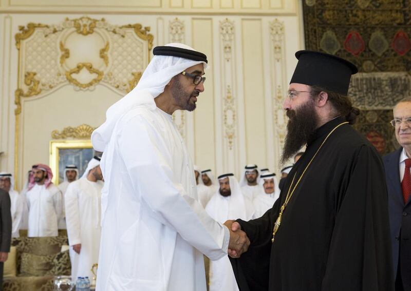Sheikh Mohammed talks to a member from the delegation of the Greek Orthodox Patriarch of Antioch and all the East.