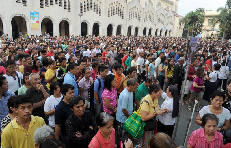 Filipino Catholics queue up to mark Ash Wednesday, the official beginning of the Christian Lenten season in Manila.  The Philippines is one of eight countries that will account for more than half of the increase in global population up to 2050. AFP