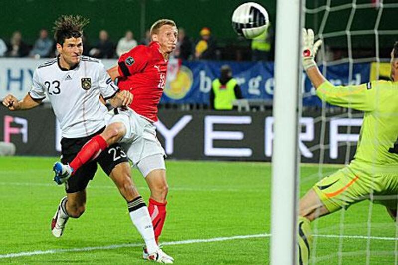 Mario Gomez scores the winning goal for Germany in the dying moments of the game in Ernst-Happel Stadium.