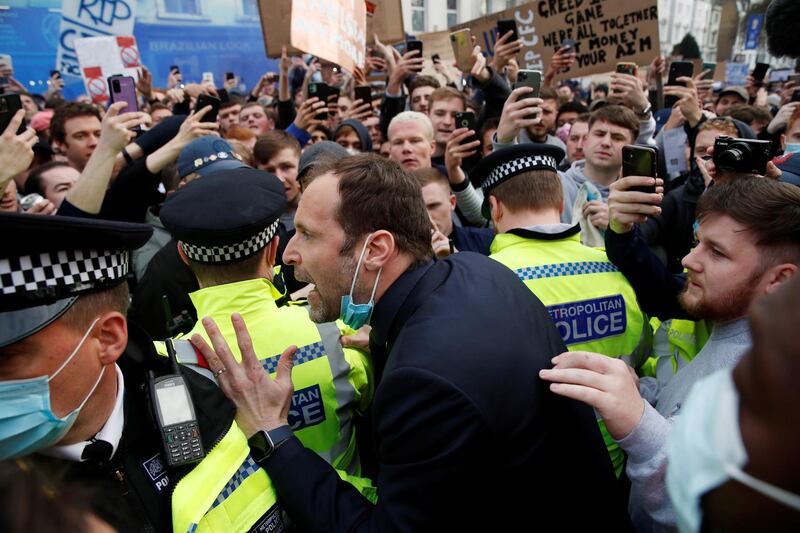 Chelsea technical adviser Petr Cech talks to Chelsea fans protesting over the European Super League ahead of their Premier League game against Brighton at Stamford Bridge on Tuesday, April 20.