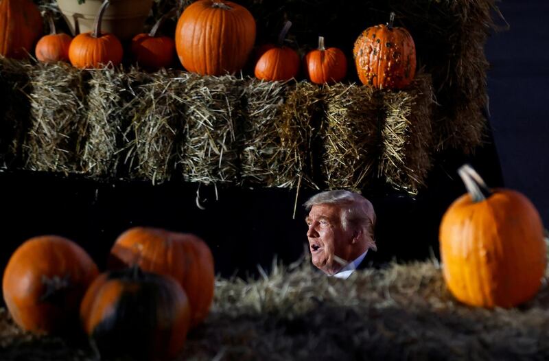 U.S. President Donald Trump is seen between pumpkins during a campaign rally at Pittsburgh-Butler Regional Airport in Butler, Pennsylvania , U.S., October 31, 2020. REUTERS/Carlos Barria     TPX IMAGES OF THE DAY