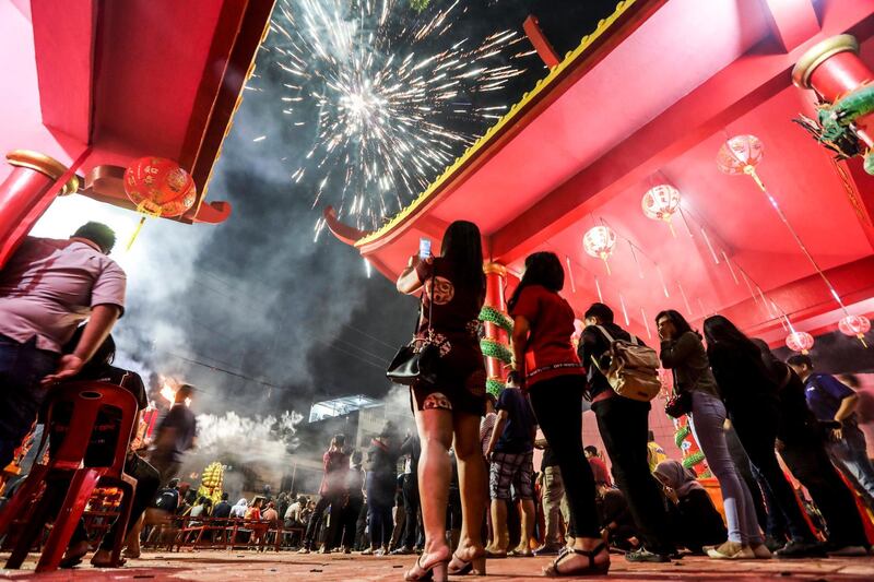 Fireworks light up the sky at the Pak Pie Hut Cou temple in Medan, North Sumatra, Indonesia. Dedi Sinuhaji / AFP Photo