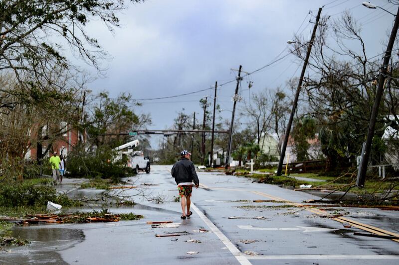 A local walks down the street after Hurricane Michael made landfall in Panama City, Florida. AFP