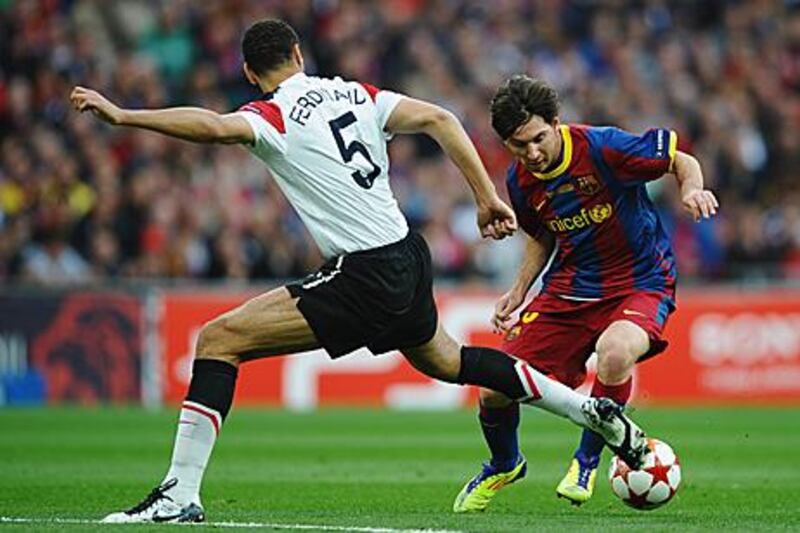 Lionel Messi dribbles the ball past Manchester United’s Rio Ferdinand as Barcelona beat their English opponents in the Champions League final, 3-1.