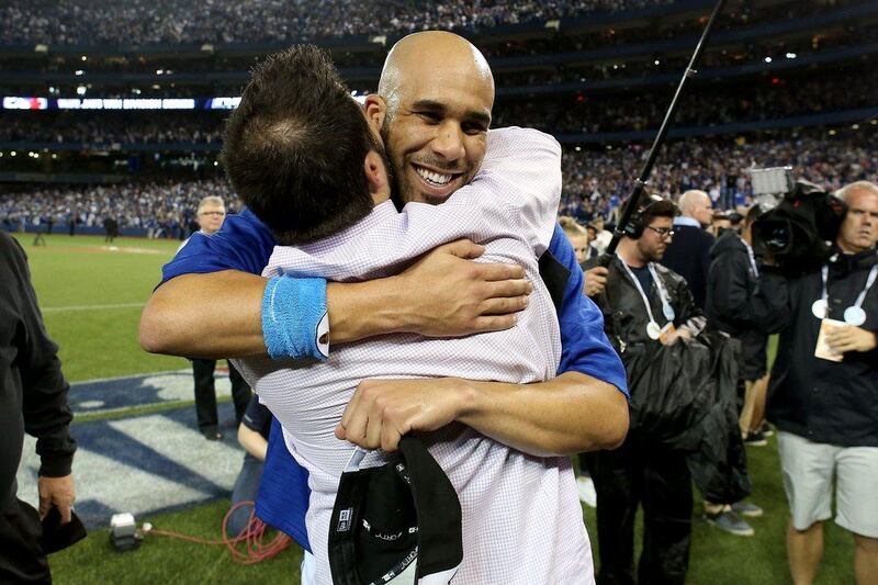 Toronto Blue Jays general manager Alex Anthopoulos and pitcher David Price celebrate after the team’s win in the fifth game of the ALDS. Tom Szczerbowski / Getty Images / AFP